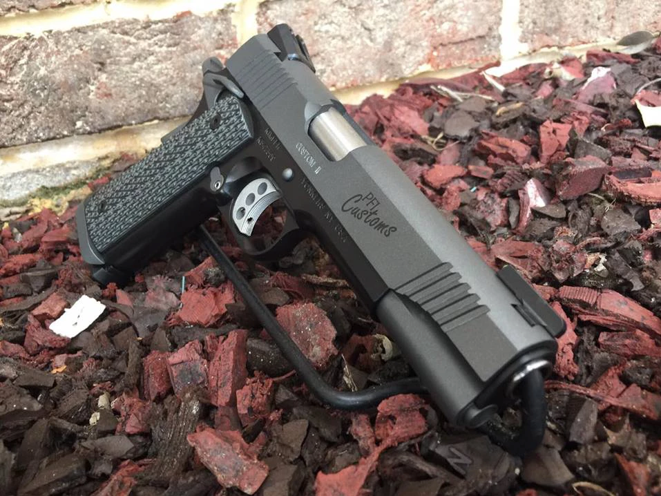 PFI custom pistol on a dark background